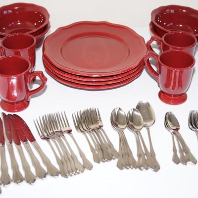 SERVICE FOR FOUR OF STONEWARE IN DARK CRANBERRY COLOR AND SET OF ONEIDA STAINLESS FOR SIX