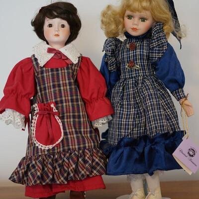 PAIR OF CLASSICAL TREASURE PORCELAIN DOLLS VERY NICE WITH CUTE GINGHAM CLOTHING AND SWEET FRECKLES.