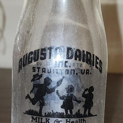 Milk jugs and carrier.