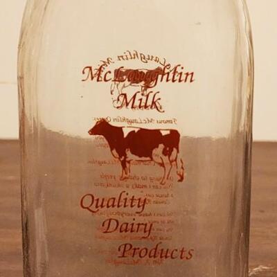Milk jugs and carrier.
