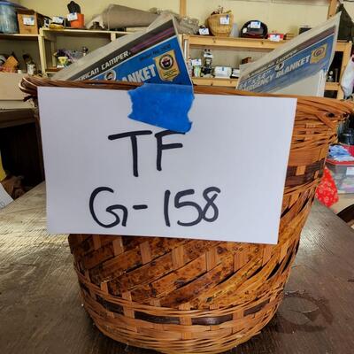 Basket with emergency blankets and umbrella