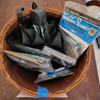 Basket with emergency blankets and umbrella