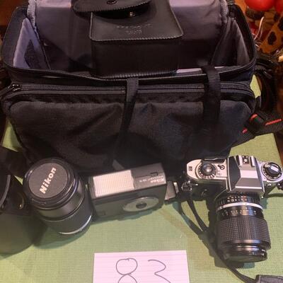 Nikon camera, extra zoom lens, and speed light flash