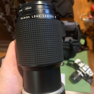 Nikon camera, extra zoom lens, and speed light flash