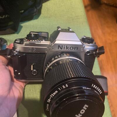 Nikon camera, extra zoom lens, and speed light flash
