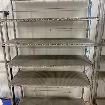 S88 Metal shelving on wheels, 75 and three-quarter inches tall, 18 inches deep, 47 1/2 inches wide. Has rust
