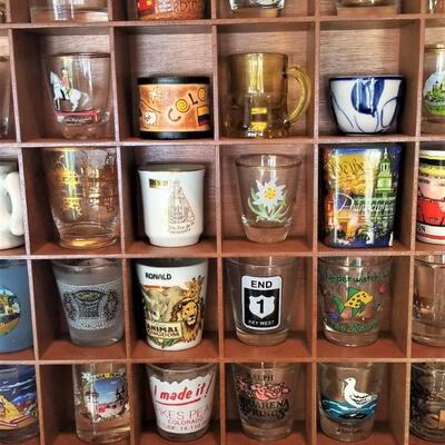 Lot #53  Lot of 36 mixed Shot Glasses in Wooden Rack