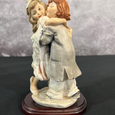 Girl & Boy Embracing Figurine