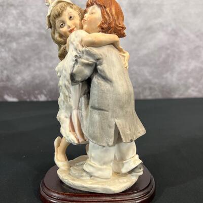 Girl & Boy Embracing Figurine
