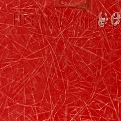 4 red Herman Miller molded plastic chairs