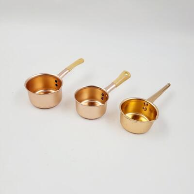 COPPER COLORED MEASURING CUPS