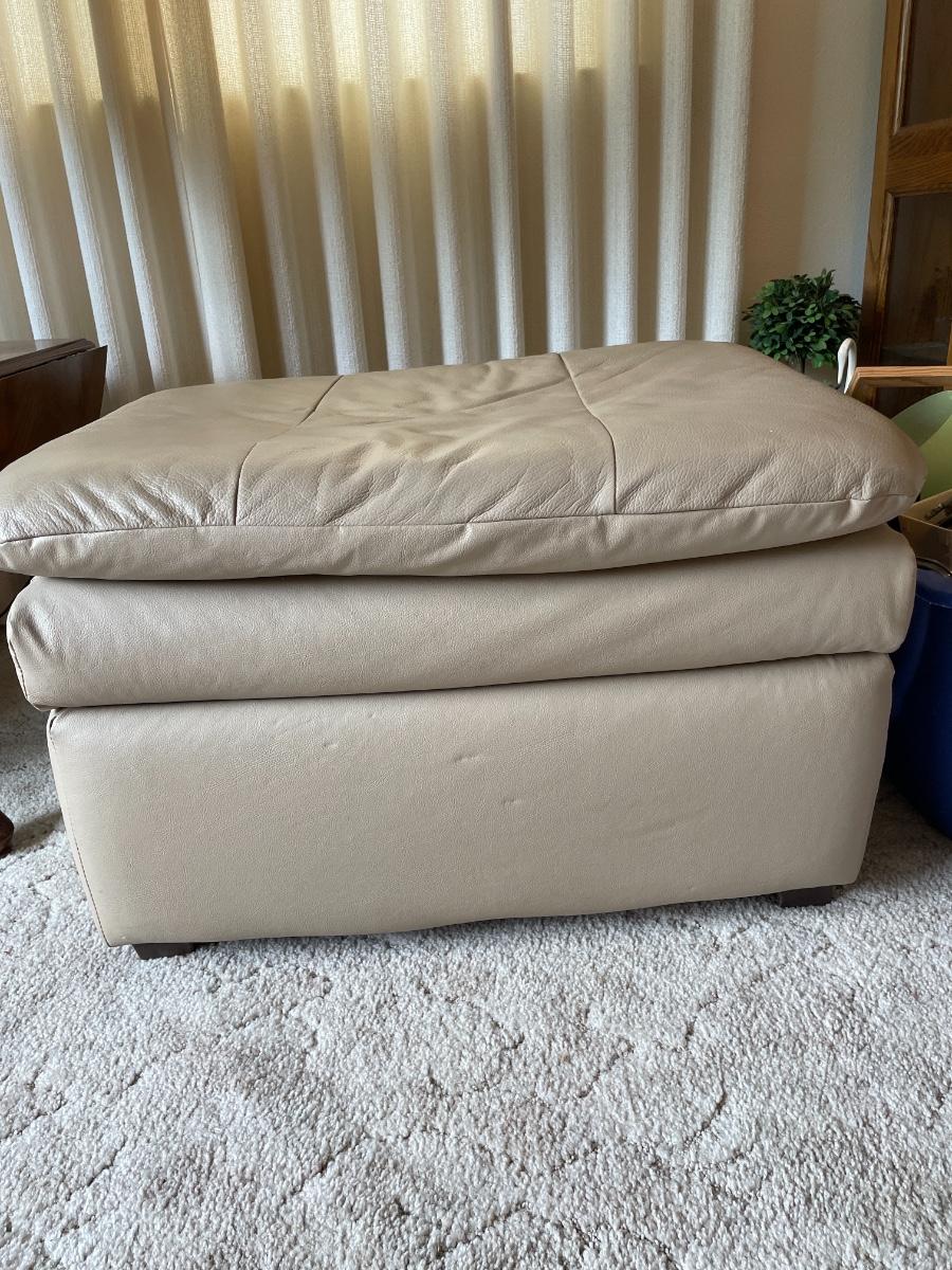 Cream leather ottoman in good shape. 30”wx24”dx19”h