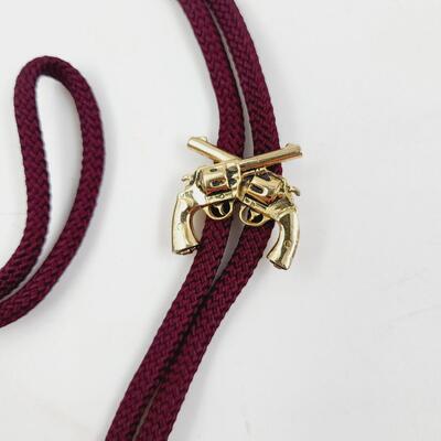 SWANK 2 GUN GOLD TONED BOLO TIE