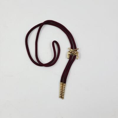 SWANK 2 GUN GOLD TONED BOLO TIE