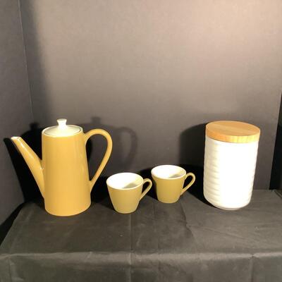 Lot 3042. Three Piece Mid-Century Modern Homer Laughlin Burnt Orange Orbit Ceramic Coffee Set & Ceramic Canister