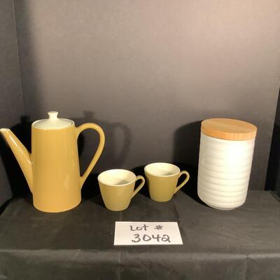 Lot 3042. Three Piece Mid-Century Modern Homer Laughlin Burnt Orange Orbit Ceramic Coffee Set & Ceramic Canister