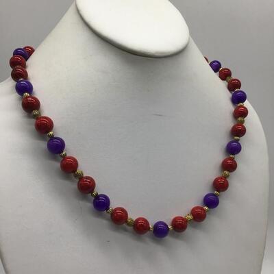 Heavy Glass Beaded Necklace. Beautiful purple Red Gold Tones.