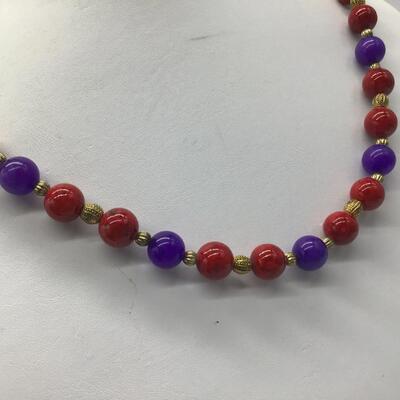 Heavy Glass Beaded Necklace. Beautiful purple Red Gold Tones.