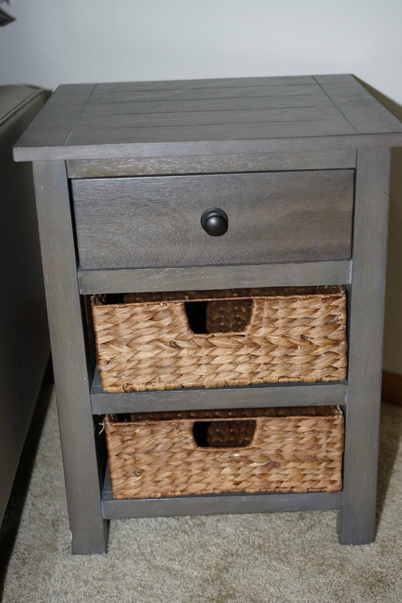 ONE DRAWER STAND WITH TWO RATTAN DRAWERS ON SHELVES BELOW IN GREY TONED