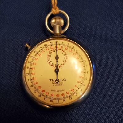 Thaco Stopwatch in glass stand