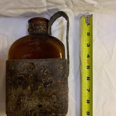 Leather sheathed brown bottle