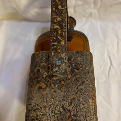 Leather sheathed brown bottle