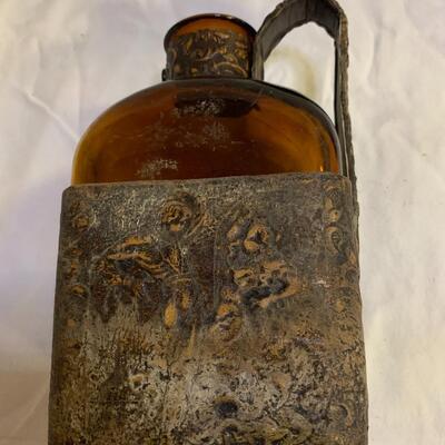 Leather sheathed brown bottle