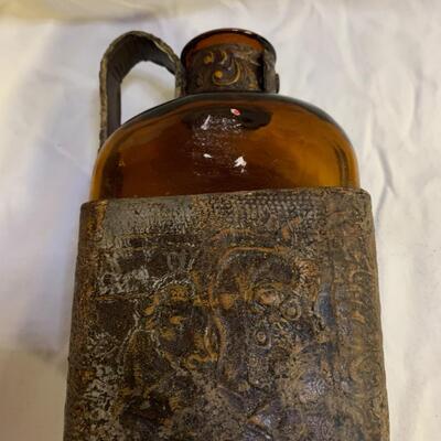 Leather sheathed brown bottle