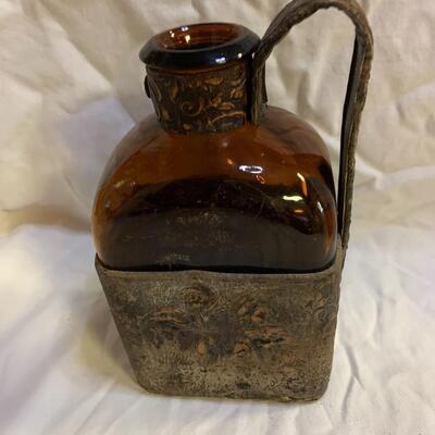 Leather sheathed brown bottle