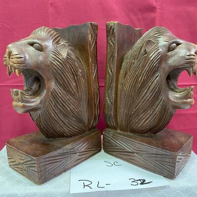 Wooden lion bookends