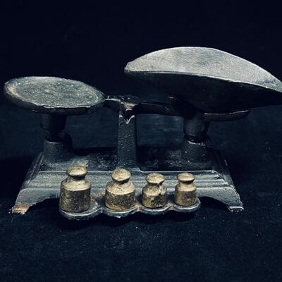 Antique small cast iron scale complete with weights