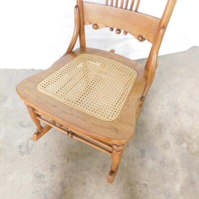 Antique Wood Rocker with Stick and Ball Accents and Cane Seat