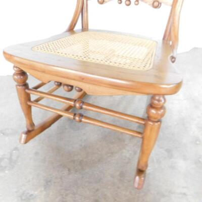 Antique Wood Rocker with Stick and Ball Accents and Cane Seat