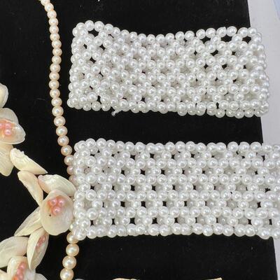 faux pearl woven bracelets, 3 pair faux pearl clip-on earrings 30" faux pearl stand, Shell necklace with pink pearls.