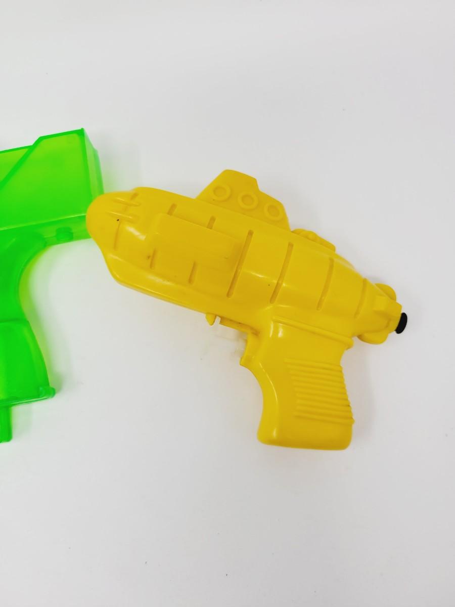 VINTAGE PLASTIC SQUIRT GUNS | EstateSales.org