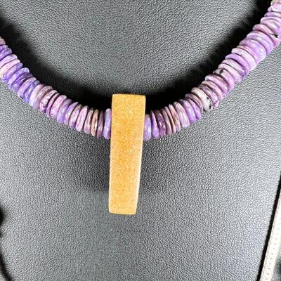 SS 28" chain with SS set Purple stone. 3 beaded necklaces 1 shell heshi with wood centerpiece.