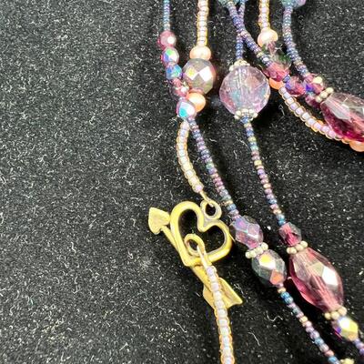 SS 28" chain with SS set Purple stone. 3 beaded necklaces 1 shell heshi with wood centerpiece.