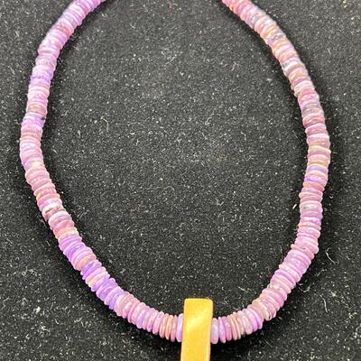 SS 28" chain with SS set Purple stone. 3 beaded necklaces 1 shell heshi with wood centerpiece.