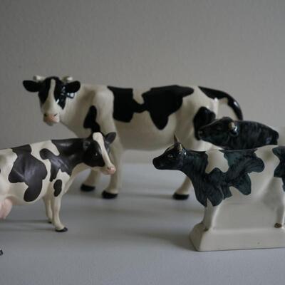 GROUPING OF FOUR BOVINE FIGURINES. TWO SIGNED RYE POTTERY OF ENGLAND