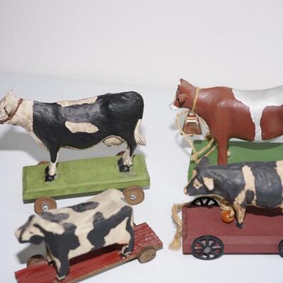 FOLK ART OF FOUR BOVINE BULL AND COW PULL TOYS ON WOOD PLATFORMS. ATTRUTED TO LEO SMITH