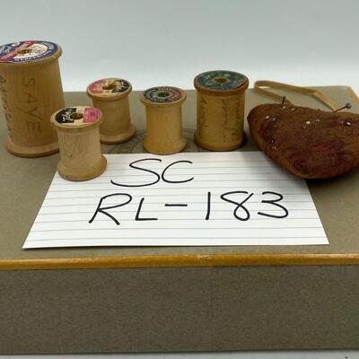 Wooden thread spools and pin cushion