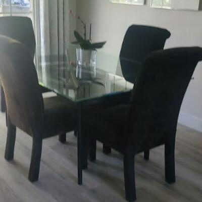 4 Black Chairs with Glass table