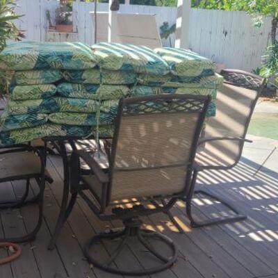 Patio Set - 2 swivel/rocking chairs, 4 fixed chairs glass table and pads for chairs