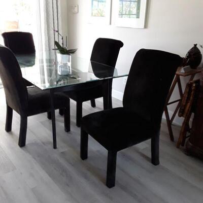 4 Black Chairs and glass table