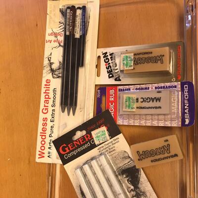 Tray of colored pencils & artist erasers