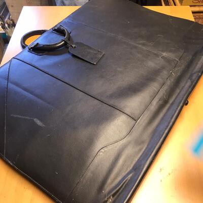 Artist Travel Bag Full of Paper targets, maps, and other wildlife items