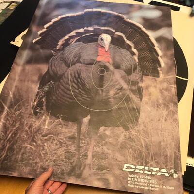 Artist Travel Bag Full of Paper targets, maps, and other wildlife items