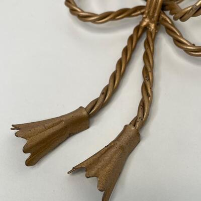 Gold metal tied bows small shelfs