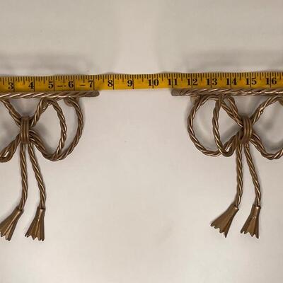 Gold metal tied bows small shelfs
