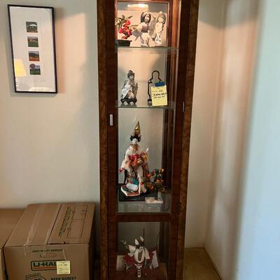 Lighted display cabinet with glass shelves and patterned wood